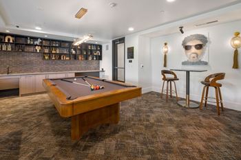 Clubroom with billiards table and bar area for entertaining